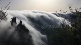 Rain in China causes 'cloud waterfall' to appear