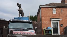 Dad installs 10ft dinosaur on top of garage to 