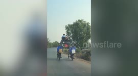 Incredible modified vehicle made from two motorcycles cruises along road