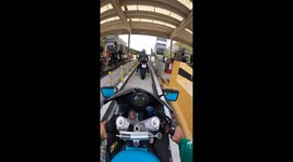 Motorcyclist pays toll with unexpected twist: toll bar mishap caught on video