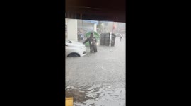 Torrential chaos: Buenos Aires streets submerged as floods carry trash bins adrift