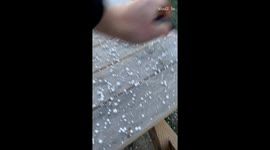 Man discovers the art of collecting inedible Dippin' Dots while scraping snow off of table