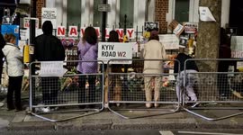 Navalny supporters light candles in London for former opposition leader as hundreds of Russians are arrested at memorial events