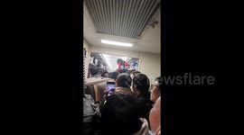 Chinese girl in jam-packed train climbs over passengers to reach toilet