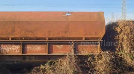 Stockshots: Driving past old rusty freight trains in Simeria, Romania