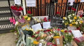 Alexei Navalny tributes at the makeshift memorial opposite the Russian Embassy in London