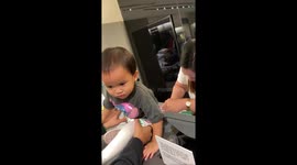 Child insists on keeping shirt on during store checkout