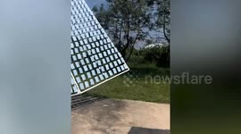 Resident uses hundreds of mirrors to reflect sun to grill chick