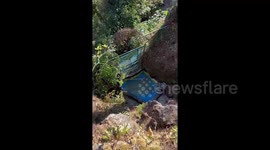 Brave staff member retrieves phone from 10-foot wishing well in the Philippines