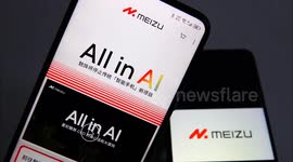 A citizen shows Meizu information on his mobile phone in Yichang, China