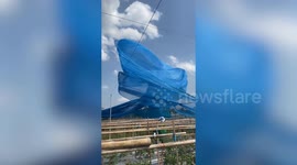 Dust devil tornado blowing this huge net looks mesmerising