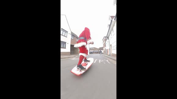 Santa was spotted today 'practicing' a new invention ... The board travelling aroung 18 mph uphill appears to 'Float' on air has it glides