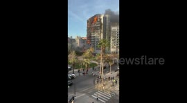 Fire engulfs high-rise building in Spain