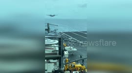 Intense Landing and Takeoff of Navy COD Aircraft on The CVN69 Ship Carrier in Yemen