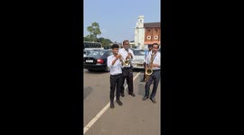 Musicians play their lungs out playing wind instruments during a funeral in the Indian state of Goa