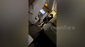 Passenger HEADBUTTS air steward in Emirates business class