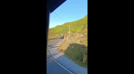 Truck pushed back by elephant searching vehicle for food in southern India