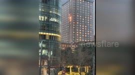 Fire breaks out on giant sign on five-star hotel's facade in China