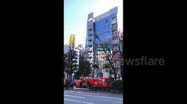 Japan: Strong Winds Blow Signboard Off Building In Ikebukuro, Tokyo