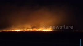 Flames from Smokehouse Creek fire illuminate Texas horizon