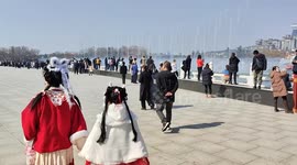 People view a musical fountain at the Datang Lotus Garden in Xi'an, China