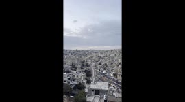 View of the downtown of the city of Amman, capital of Jordan, from above at dawn at the exact time that the call for pray sounds from a nearby mosque.