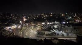 View from above of one of the main circles that organize the city of Amman, capital of Jordan, recorded at night.