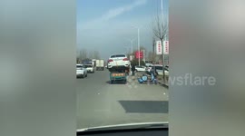 Jaw-dropping moment tricycle carries massive car atop its roof