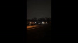 Tornado sirens echo through dark skies in Downers Grove, Illinois