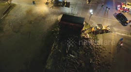 Vehicles Clear Debris from Collapsed Building Site in Covington, USA