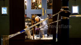 Police forensics work at scene of shooting in Clapham Common, South London as gunman remains at large