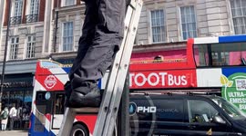 A Worker Responsible For The Installation And maintenance Of Street Lights Seen at Work By Buckingham Palace.