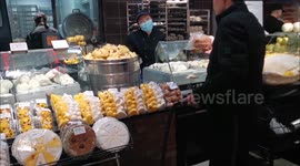 Citizens shop at a supermarket in Yichang, China