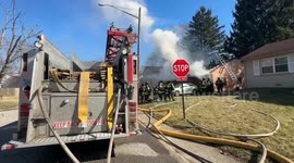 The Indianapolis Fire Department extinguishes house fire in IN, USA