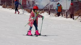 Tourists Ski at A Ski Resort in Yichang, China