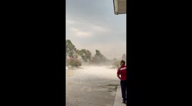 Dust devil tornado whips through petrol station in Thailand