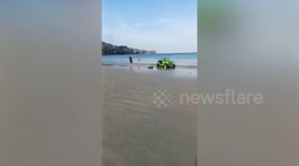 Hapless Chinese driver gets his rented jeep stuck on Thai beach
