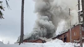 People try to put out massive fire in hotel with snowballs in Gulmarg, India