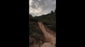 Stunt gone awry: cyclist Sam Hodgson's 100 ft flip to dirt slip and slide