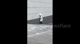 Woman's Careful Steps After Freezing Rain in Huanggang, China