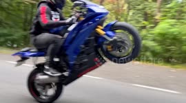 Poppin' a wheelie gone wrong! Motorcyclist crashes face first while attempting stunt