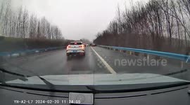 Driver navigates through still cars after possible accident in China