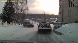 Icy hill triggers terrifying situation as motorist reverses to avoid sliding car