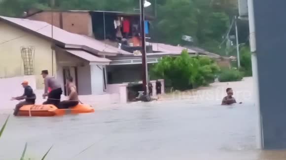 Floods submerge streets of Padang seeing officials use boats to evacuate locals