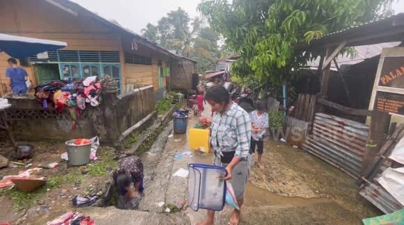 After the flood, Padang residents cleaned up - cleaned their houses and saved valuables