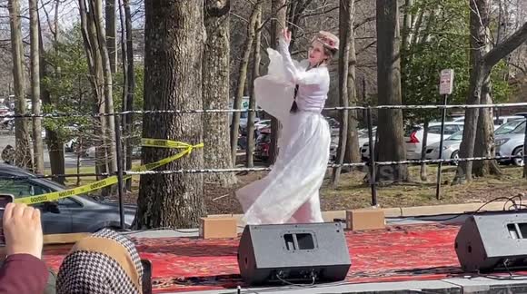 Second woman performing traditional dance at 10th Annual Nowruz Festival (Persian New Year celebration)