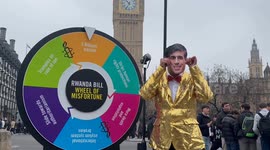 Rishi Sunak look-a-like spins Wheel of Misfortune outside parliament ahead of Rwanda Bill vote