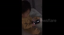 Little baby calling on the phone in Jinan, China