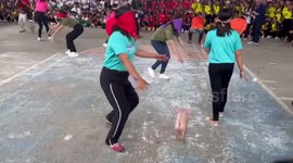 Locals try to catch piglet while blindfolded in this amusing game