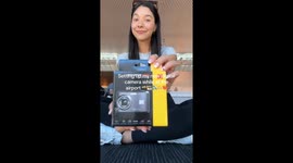 Influencer unboxes her new Kodak camera at Australia airport